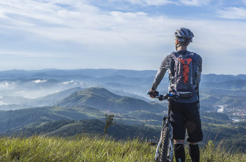 image of cyclist on a hill - compare and buy cheap cycle insurance, including electric bike insurance online