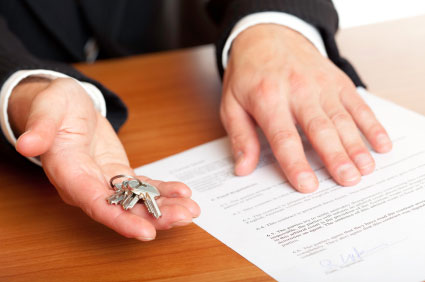 agent handing keys to tenant